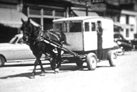 Horse drawn wagon. Black and white still from Massecar film, 1947-1949, location unknown.