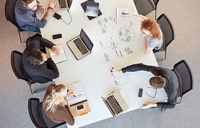 Students at a whiteboard table