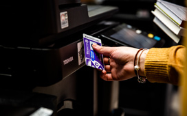 Student using their WesternOne card at a printer