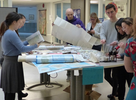 Students from the Geography Peoples' Society making map buttons