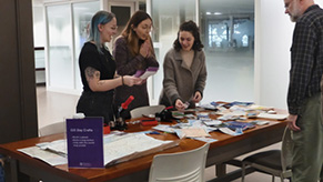 Library co-op students make custom map button crafts