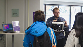 Austine shows students how the thermal camera is used in his research on urban climates