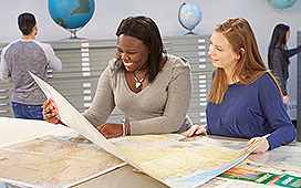 Students looking at a map