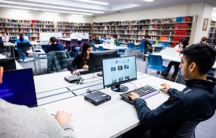 Students studying in the Music Library