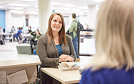 Student getting help at the service desk