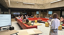 Librarian giving a presentation in the Scholars Lab.